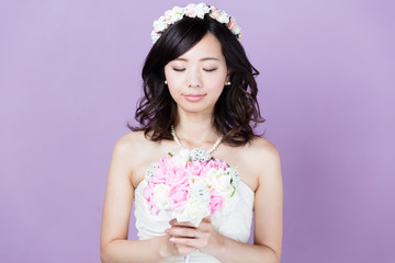 attractive asian woman wedding image on purple background