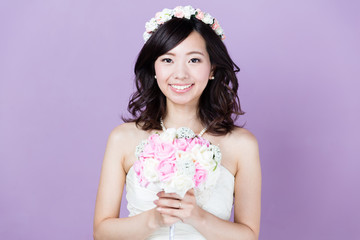 attractive asian woman wedding image on purple background