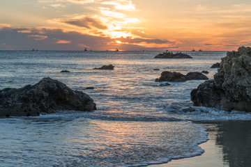 Fototapeta na wymiar sun reflected in the waves at El Matador Beach Malibu California
