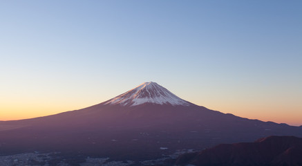 Top of Mt. Fuji and sunrise sky in autumn season