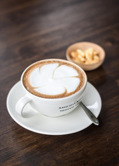cappuccino cup on top old wood table