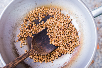 Roasted coffee bean in a pan