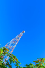 Telecommunication tower on blue sky  background.