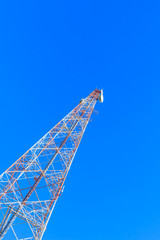 Telecommunication tower on blue sky  background.
