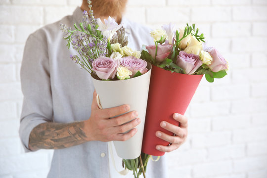 Man holding beautiful bouquets, closeup