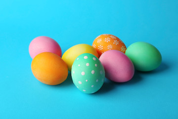 Obraz na płótnie Canvas Colorful Easter eggs on blue background