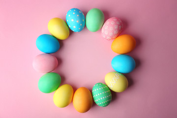 Fototapeta na wymiar Colorful Easter eggs on pink background