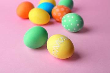 Colorful Easter eggs on pink background
