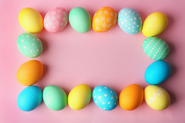 Fototapeta na wymiar Colorful Easter eggs on pink background