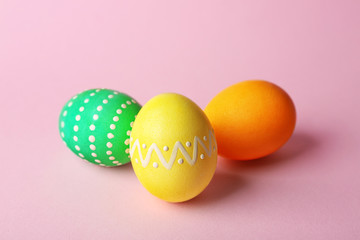 Colorful Easter eggs on pink background