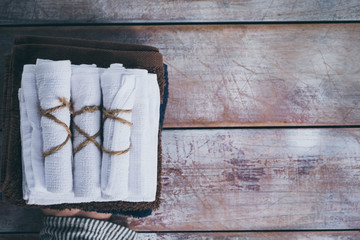 Rolled up white spa towels, selective focus, vintage