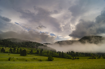 Obraz premium sunny and foggy morning in the Julian Alps, near Lake Bohinj, Sl