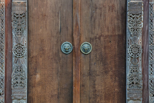 Wooden door with ancient floral patten. Wood carving technic.