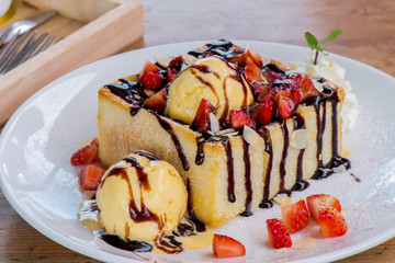 Ripe strawberry with toast and ice cream on white plate