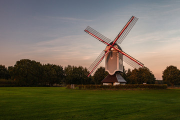 Fototapeta na wymiar A historic windmill at sunset 