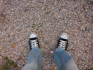 Feet on the asphalt.