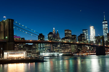 Manhattan Skyline, Brooklyn Bridge, Waterfront. at night