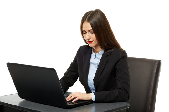 Young businesswoman at her desk with a laptop