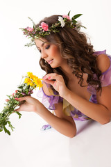 Obraz na płótnie Canvas Young Woman With Flower Garland