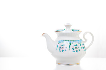 Ornamental teapot  on white background. Decorative wallpaper