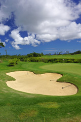 green golf course panorma sand bunker with blue sky in summer