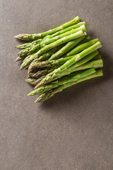 Fresh green asparagus. Farmer's Market. Gray background. Top vie