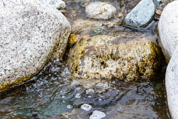 Fototapeta na wymiar clean water among the stones