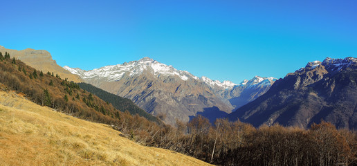 Great landscape on the Orobie Alps in winter season close to Cardeto natural lakes. View of the highest mountains including Pizzo Coca. Seriana Valley, Bergamo, Italy. 