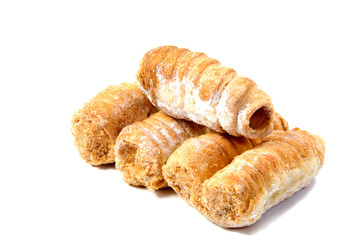 Rolls with cream on a white background.