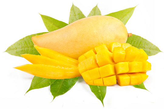 Mangoes sliced decorated with leaves isolated