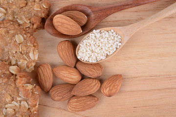 Almonds and Sesame seeds on the wooden floor