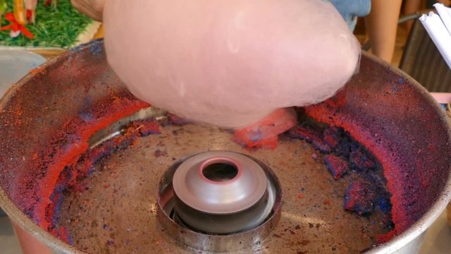 People make cotton candy for children