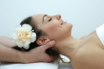 Obraz na płótnie Canvas Woman enjoying a massage treatment