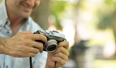 Fototapeta premium Photographer watching his pictures