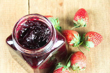 jam strawberries  on wood