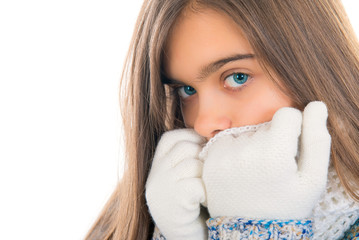 portrait of beautiful little girl in warm clothing outdoors. Winter Portrait of Female with Beautiful Blue Eyes outdoor. teen girl with long hair in warm winter clothes on white
