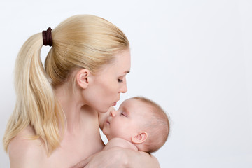 caucasian mother holding cute baby