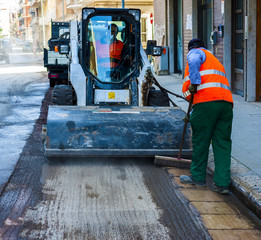 Sweeper attachments mini excavator. The sweeper sweeps, collects and dumps dirt and debris.