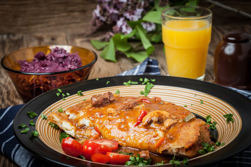 Potato pancakes with meat stew served on a plate.