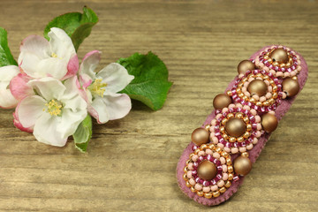 Hair slide on wooden background