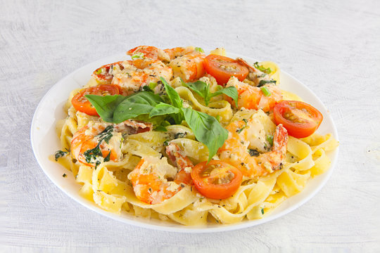 pasta with prawns on white plate
