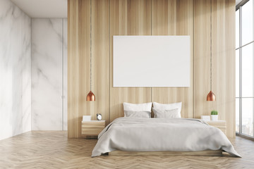 Light wood and marble bedroom with poster