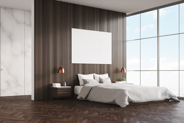 Side view of bedroom: double bed and poster