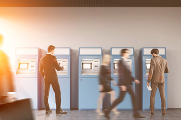 Men in a bank hall near ATM machine