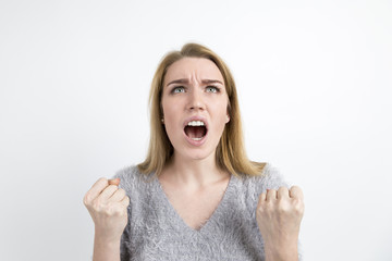 Angry blond woman screaming