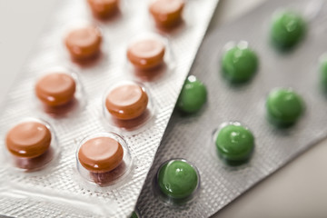 Green and orange pills