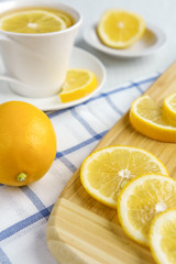 Lemons and tea on a light background