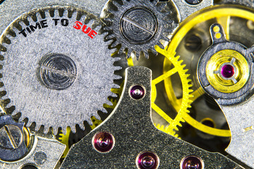 clockwork old mechanical  high resolution with words Time to Sue