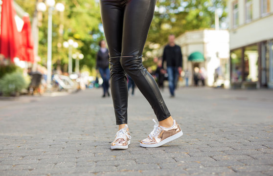Woman with shiny sneakers