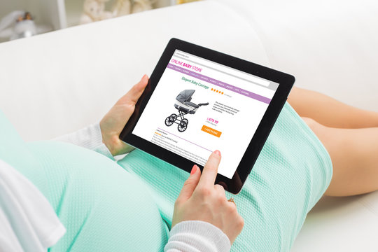 Pregnant woman shopping online on baby store